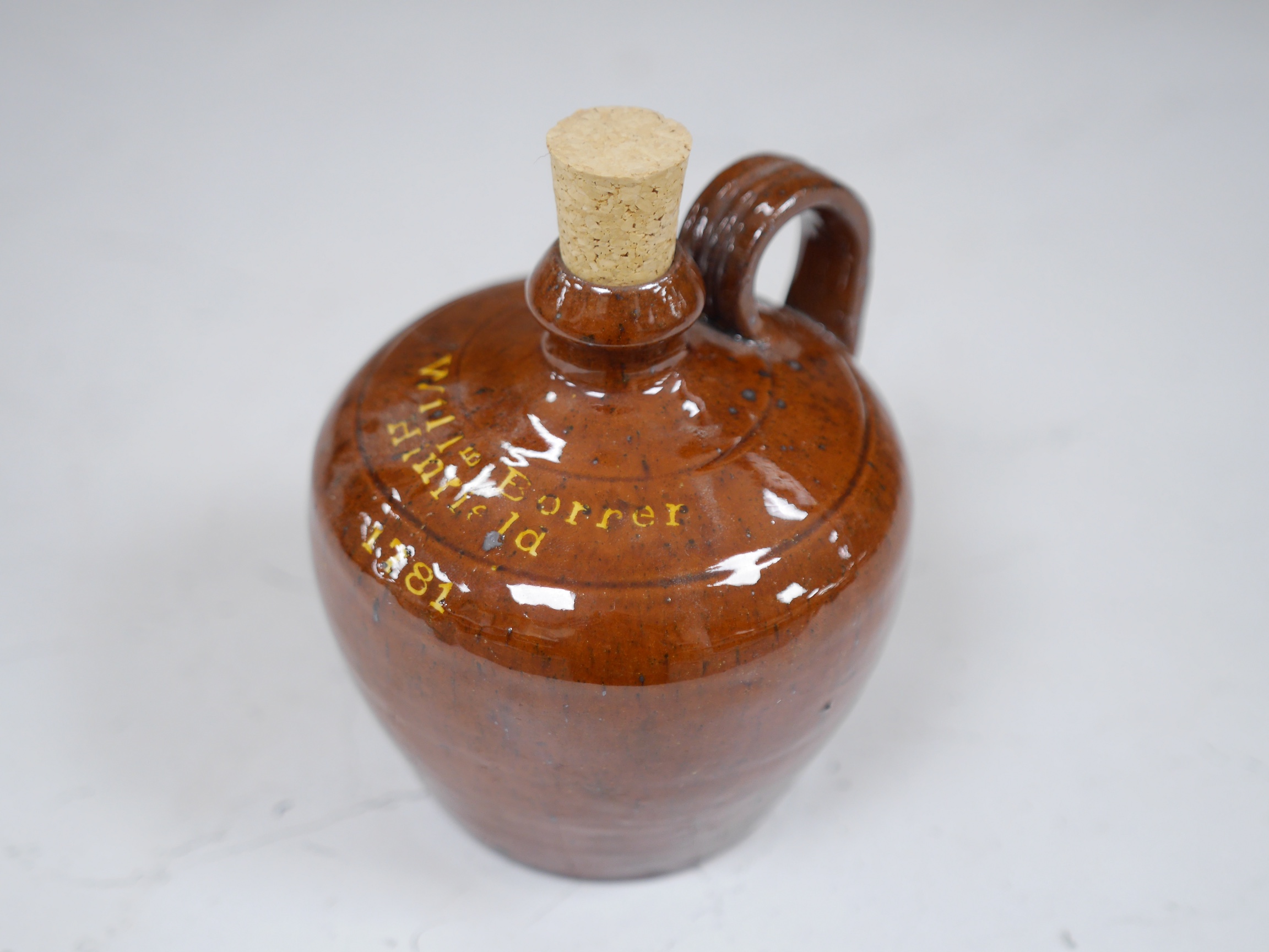 A Dicker Pottery flagon commemorating 'William Borrer, Hinfield, 1781', 13.5cm high. Condition - small glazing faults